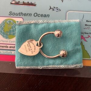 Authentic Tiffany & Co sterling key chain with Return to sender” heart tag.